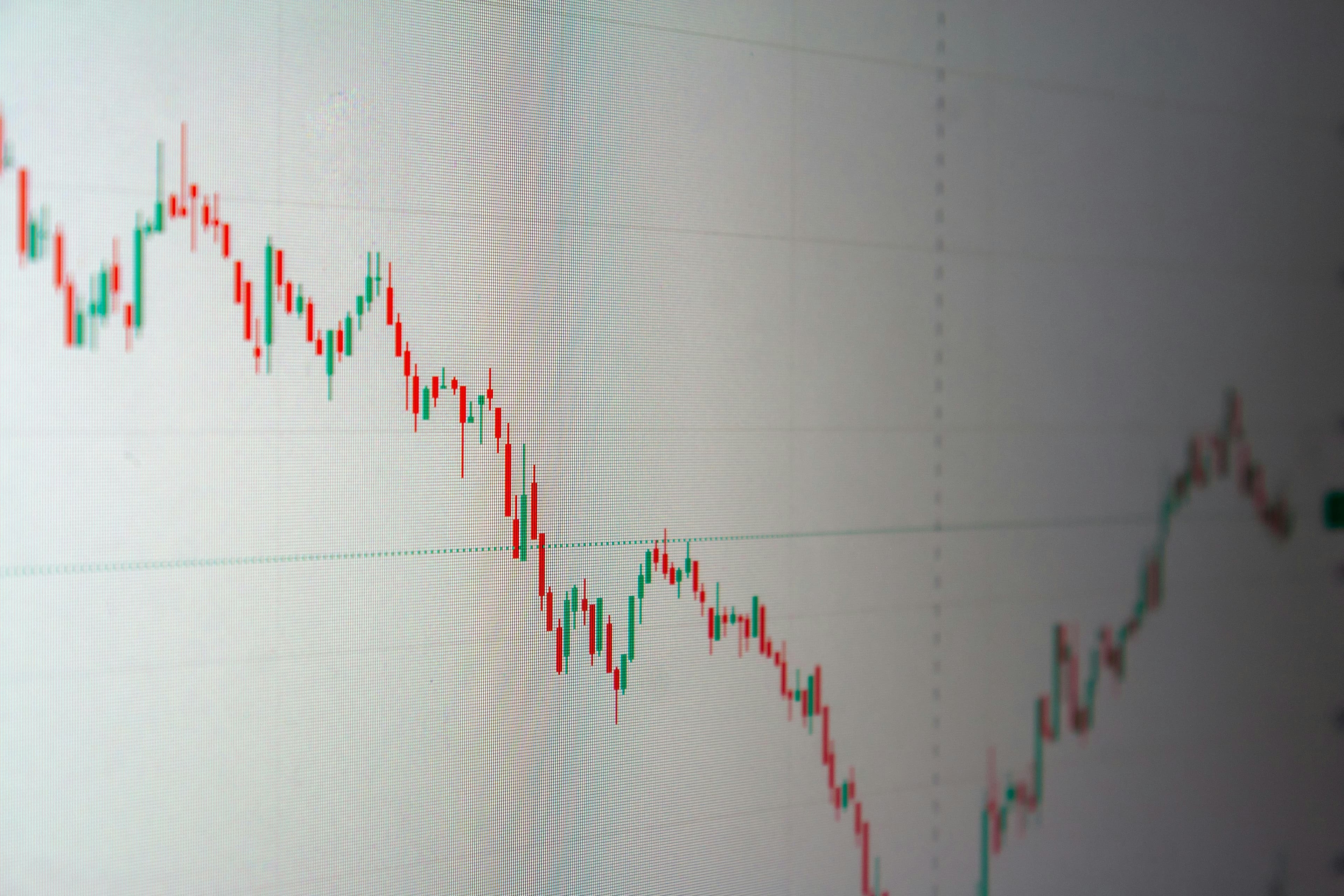 Downward-trending stock market chart on screen